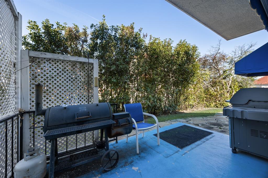 3002 Preston Court Rockwall, TX 75087 - Photo 27 of 39 a backyard of a house with table and chairs