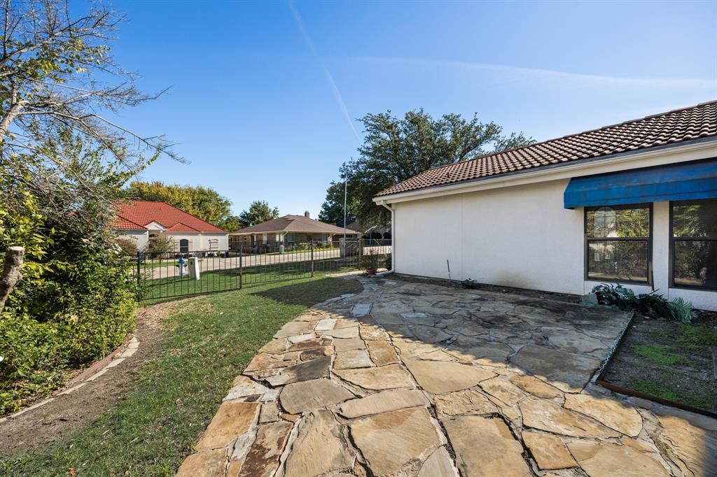 3002 Preston Court Rockwall, TX 75087 - Photo 29 of 39 a view of a house with a yard