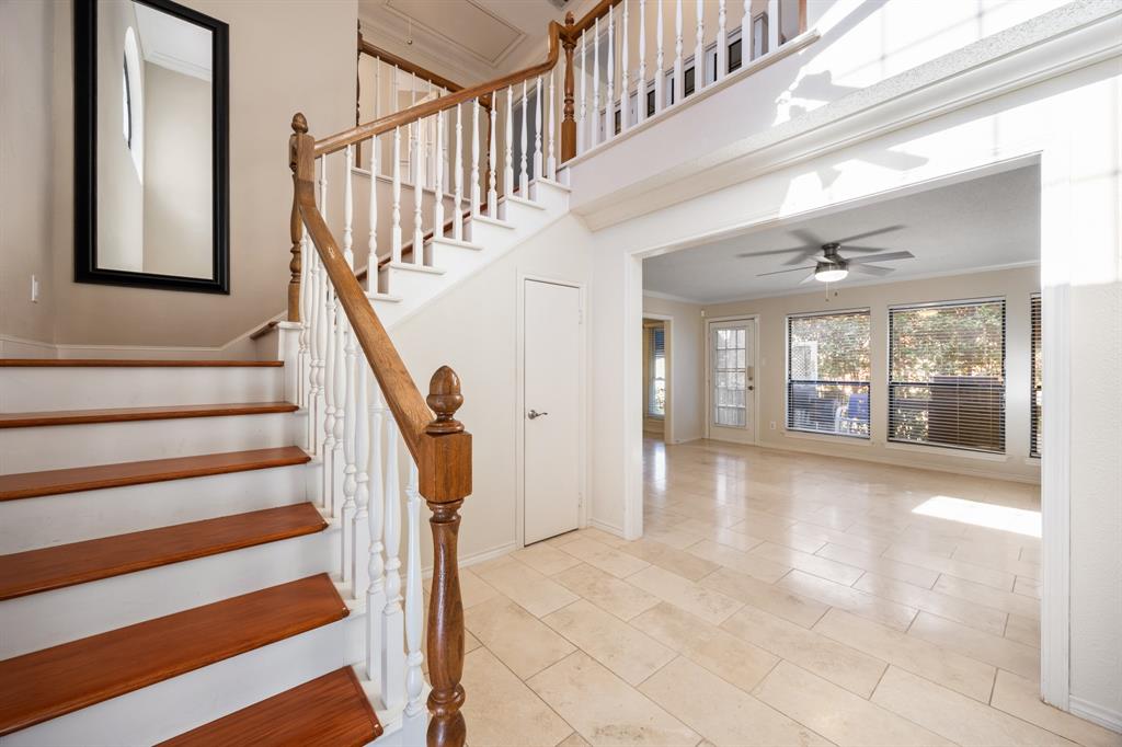 3002 Preston Court Rockwall, TX 75087 - Photo 3 of 39 a view of staircase with white walls and a window