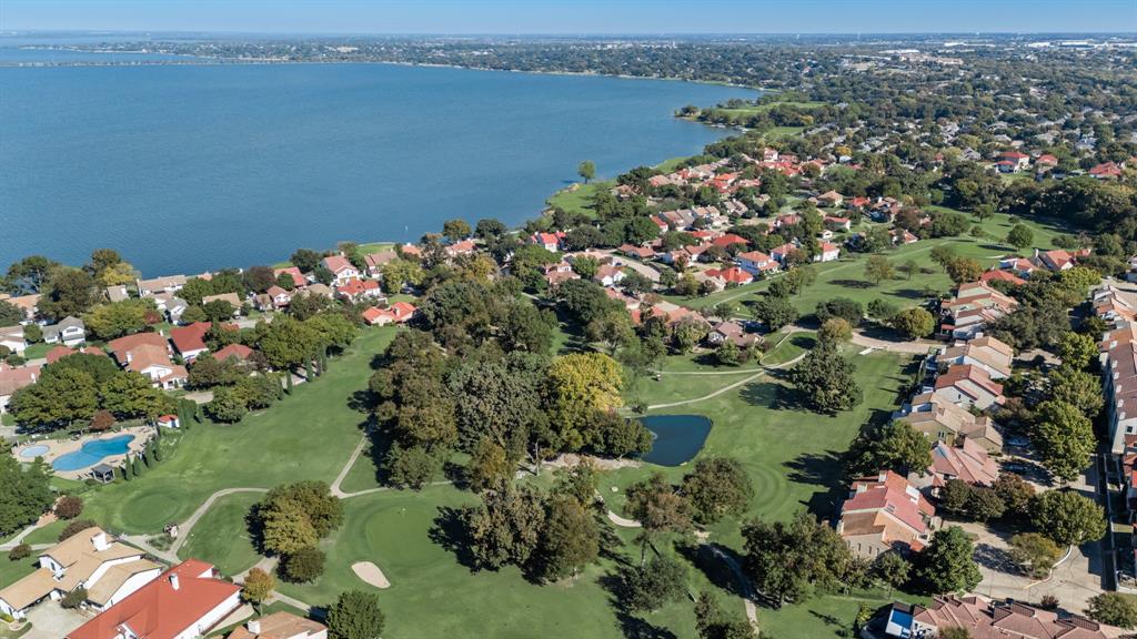 3002 Preston Court Rockwall, TX 75087 - Photo 37 of 39 a view of a lake with a house
