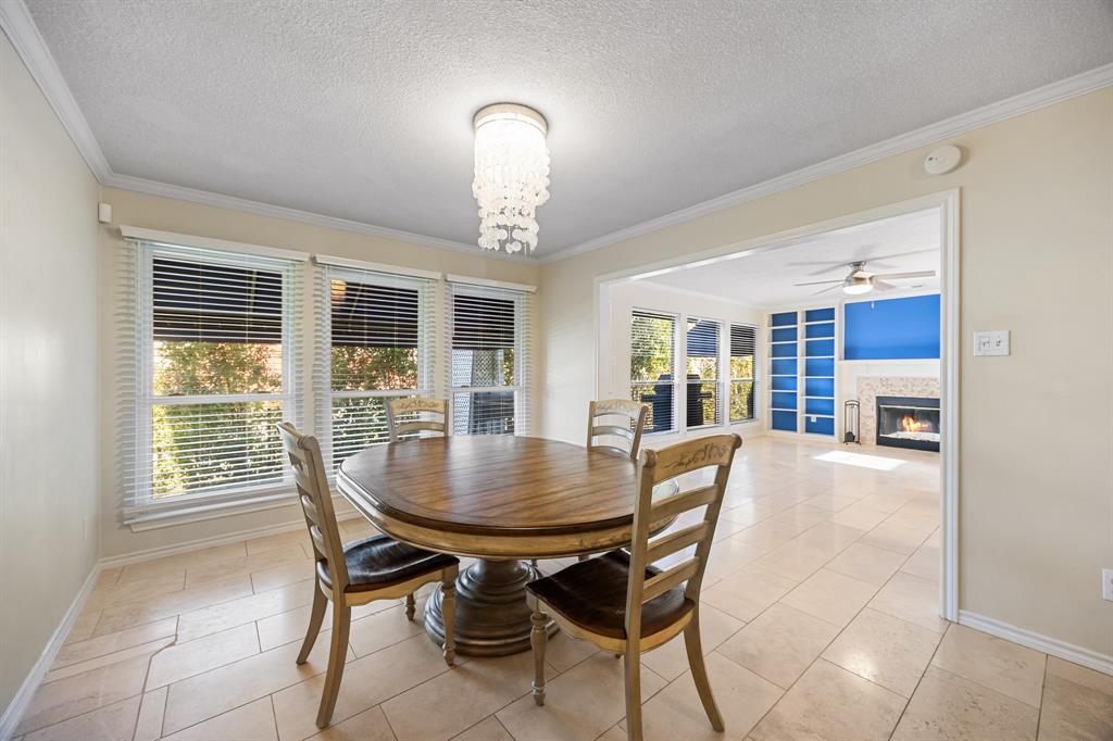 3002 Preston Court Rockwall, TX 75087 - Photo 10 of 39 a view of a dining room with furniture window and wooden floor