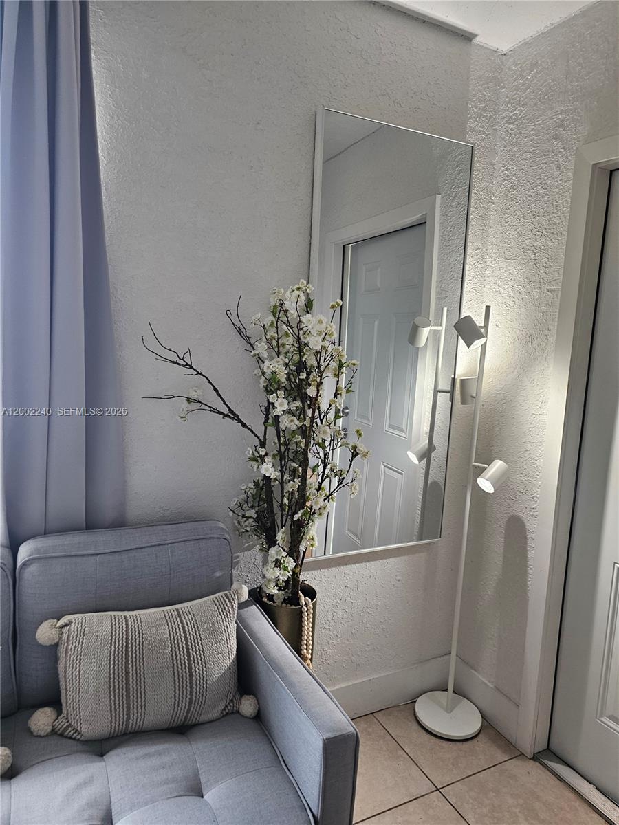 2513 Southwest 10th Street, Unit 5 Miami, FL 33135 - Photo 4 of 5 a living room with furniture and a potted plant