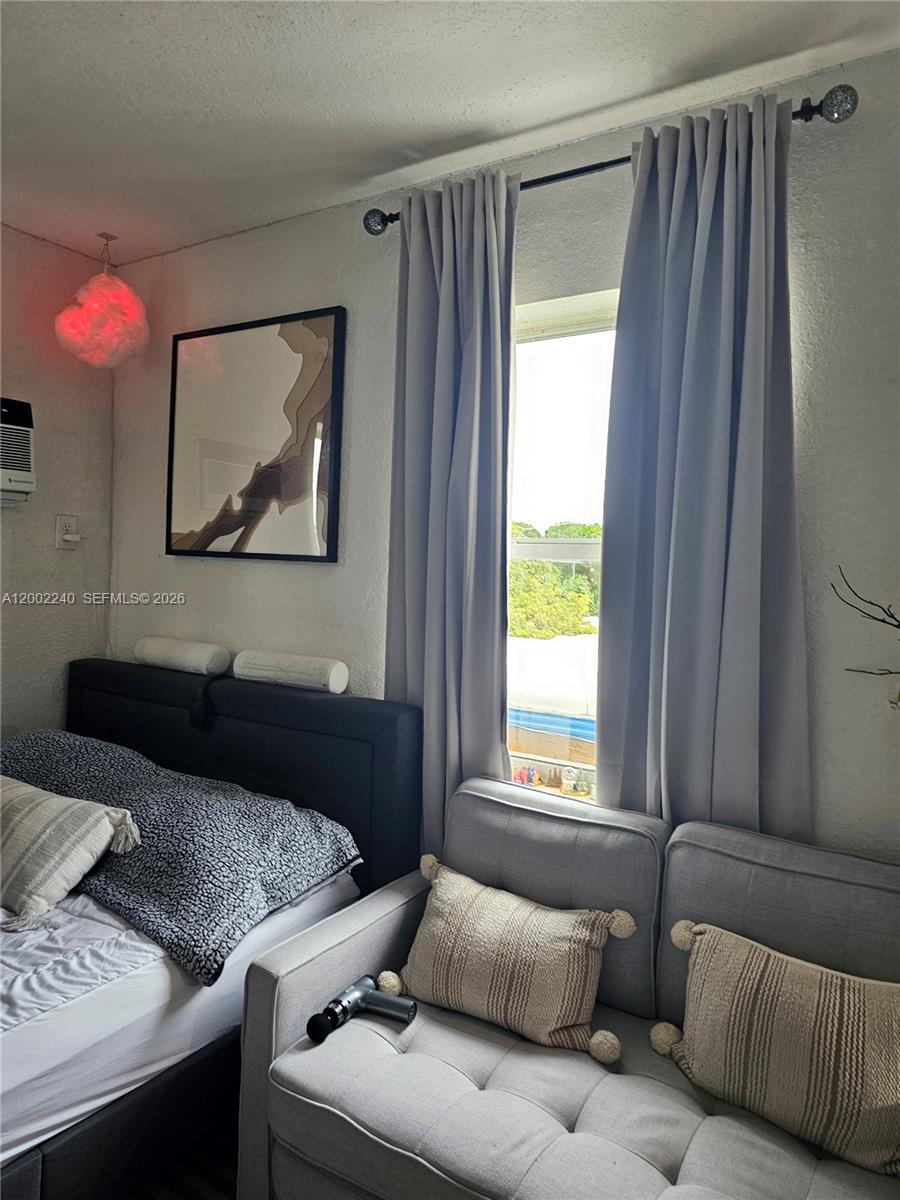 2513 Southwest 10th Street, Unit 5 Miami, FL 33135 - Photo 5 of 5 a bedroom with a bed and a window