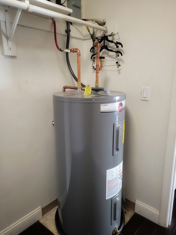 1029 Pleasant Street, Unit 20 Worcester, MA 01602 - Photo 15 of 16 a view of a room with rack and wooden floor