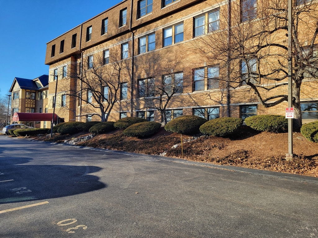 1029 Pleasant Street, Unit 20 Worcester, MA 01602 - Photo 16 of 16 a street view along with residential houses