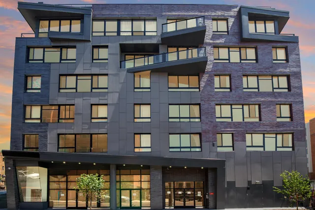 a front view of a building with glass windows