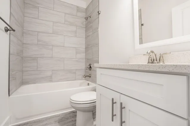 an empty room with wooden floor