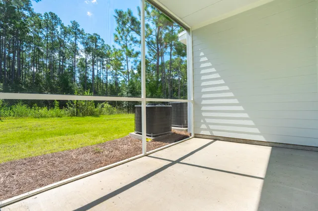 a view of a swimming pool with an outdoor seating