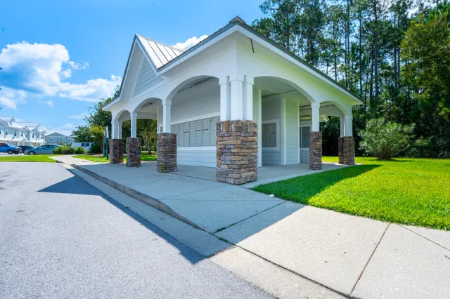 a view of a building with potted plants