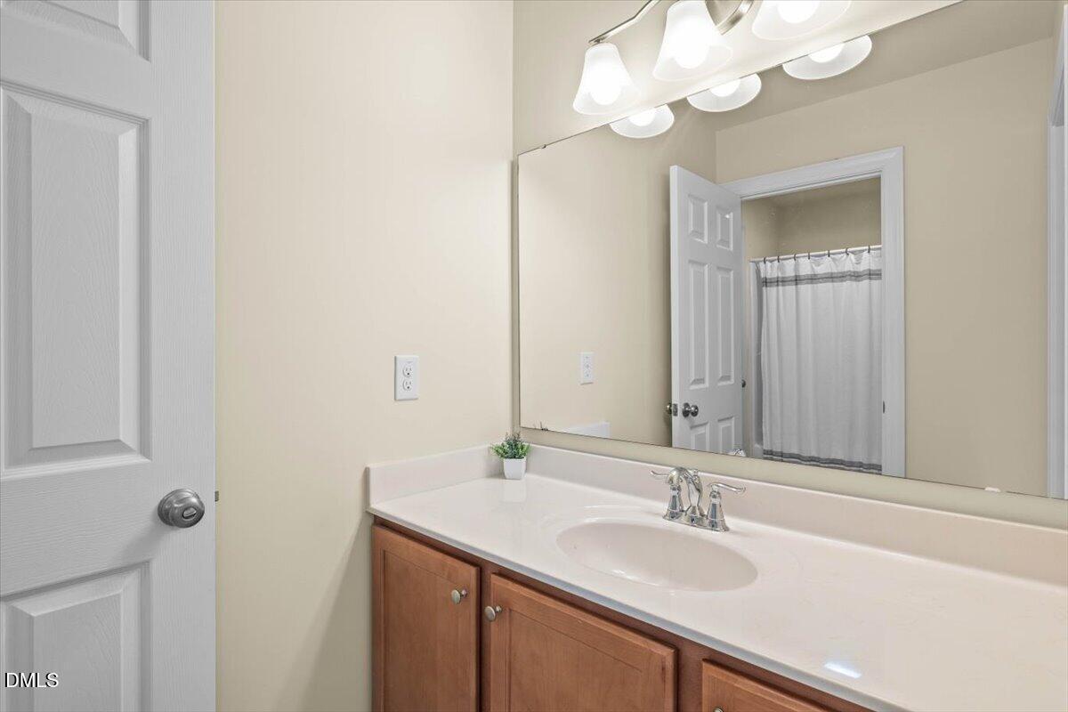 704 Haw River Hopedale Road Burlington, NC 27217 - Photo 32 of 49 a bathroom with a sink and a mirror