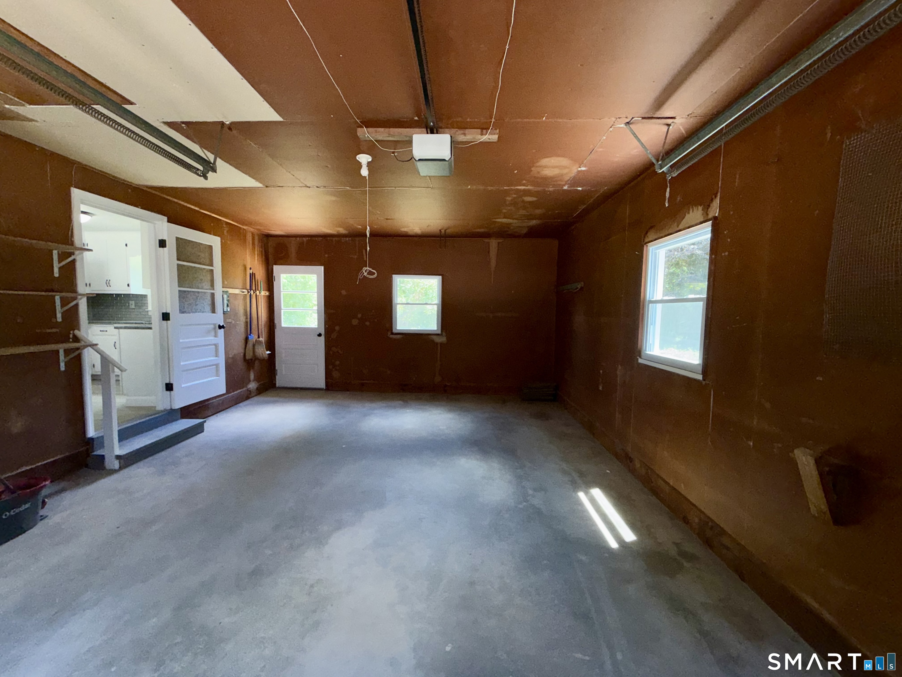 341 Harland Road Norwich, CT 06360 - Photo 27 of 29 a view of an empty room with chandelier fan and windows