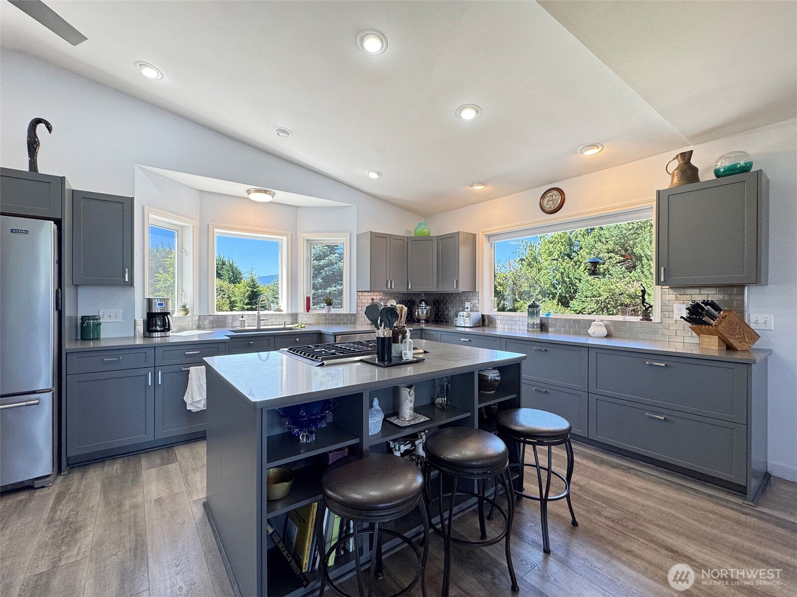 866 Jamestown Road Sequim, WA 98382 - Photo 13 of 40 a kitchen with counter space dining table and chairs