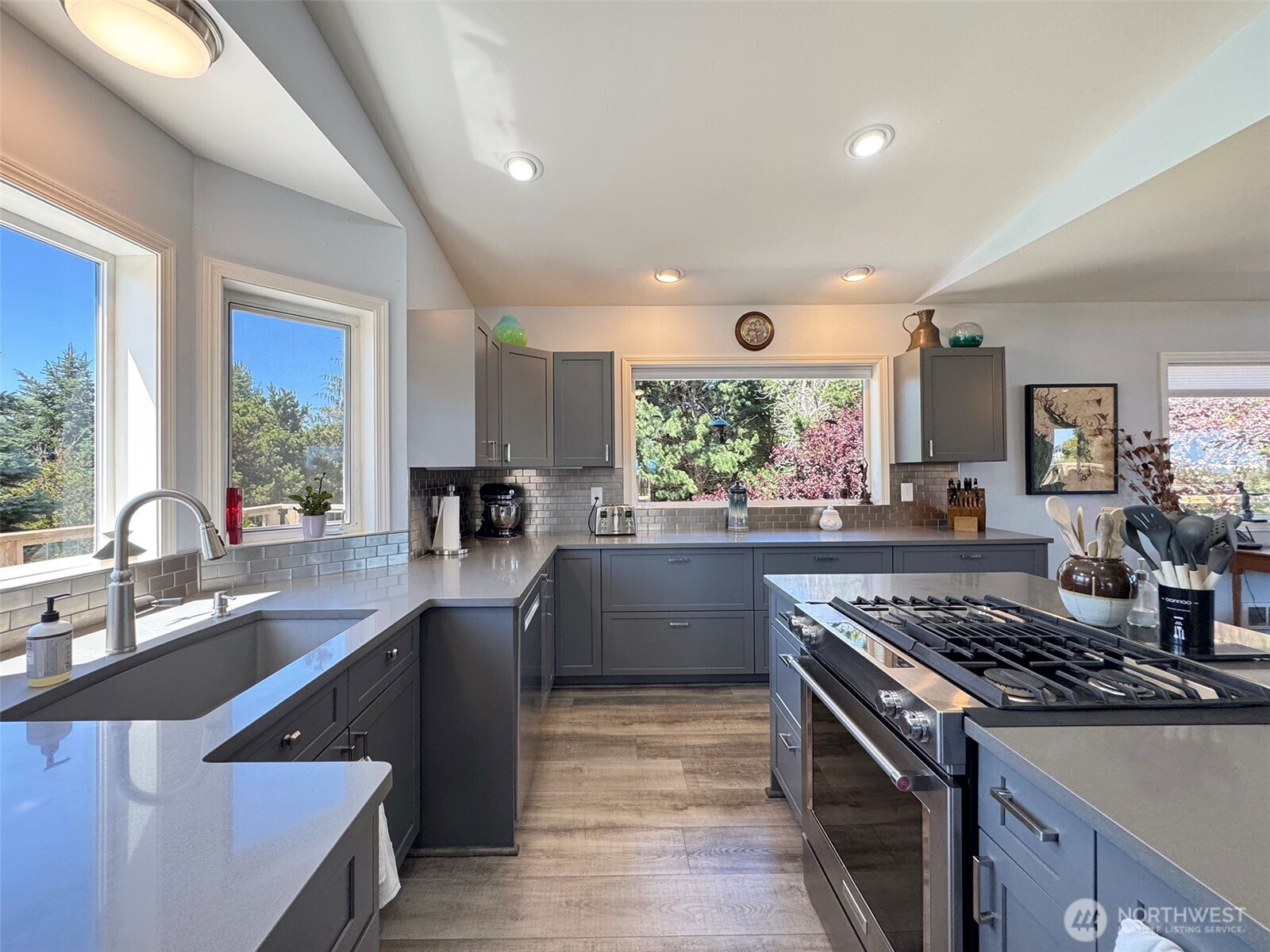 866 Jamestown Road Sequim, WA 98382 - Photo 14 of 40 a kitchen with stainless steel appliances a sink stove and cabinets