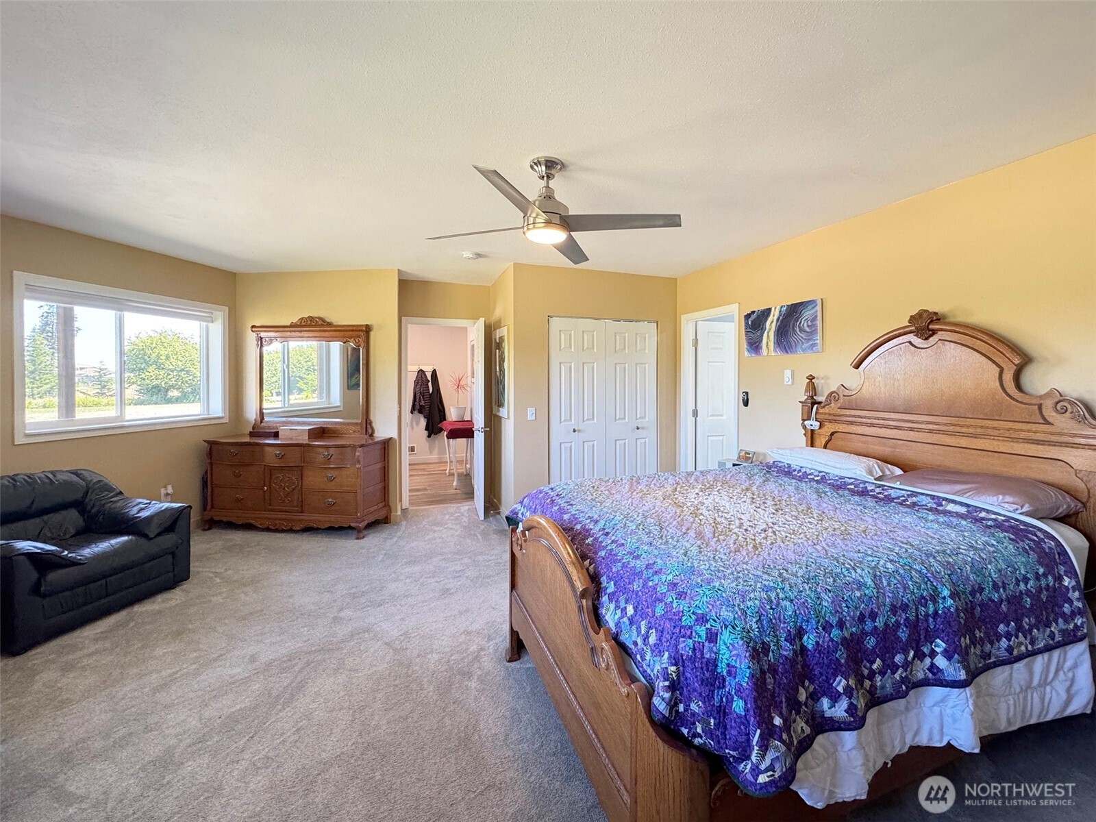 866 Jamestown Road Sequim, WA 98382 - Photo 20 of 40 a bedroom with a bed couch and window