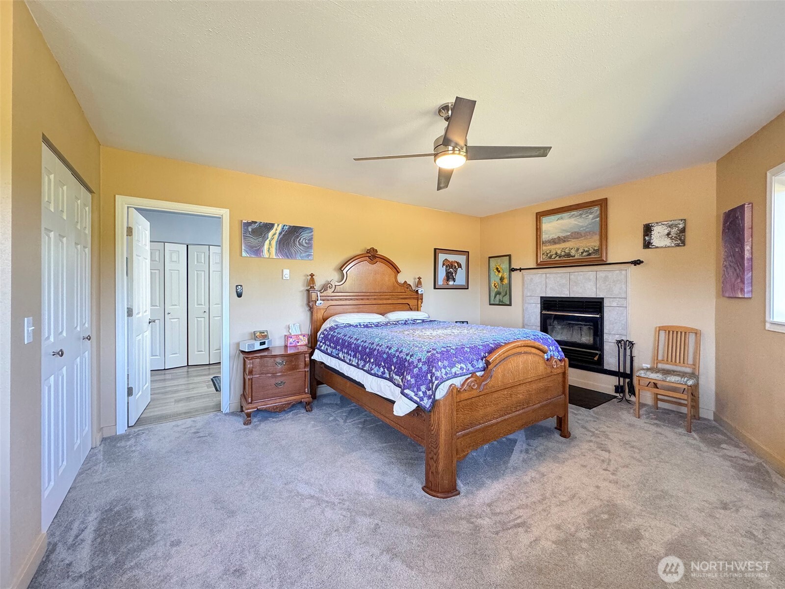 866 Jamestown Road Sequim, WA 98382 - Photo 21 of 40 a bedroom with a bed and a fireplace