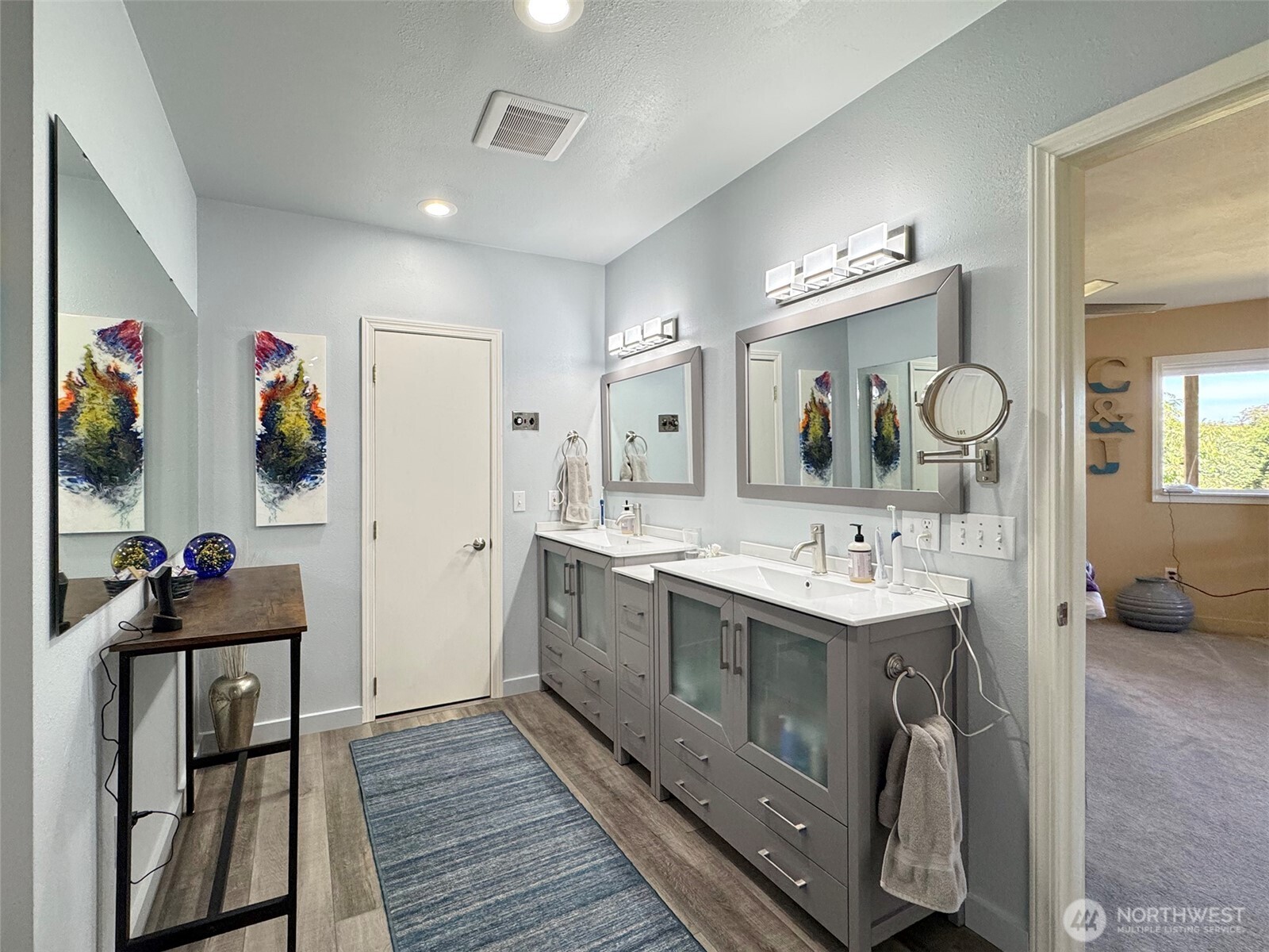 866 Jamestown Road Sequim, WA 98382 - Photo 23 of 40 a spacious bathroom with a double vanity sink and a mirror
