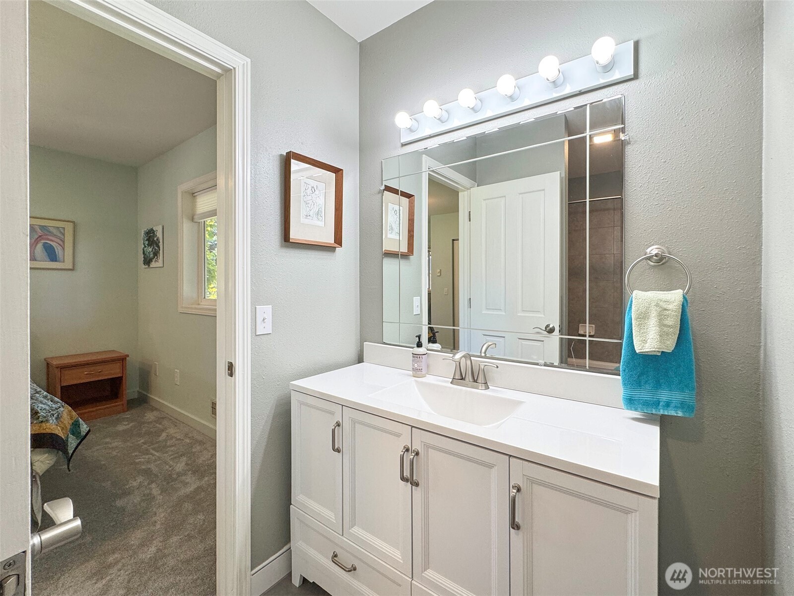 866 Jamestown Road Sequim, WA 98382 - Photo 26 of 40 a bathroom with a double vanity sink mirror and