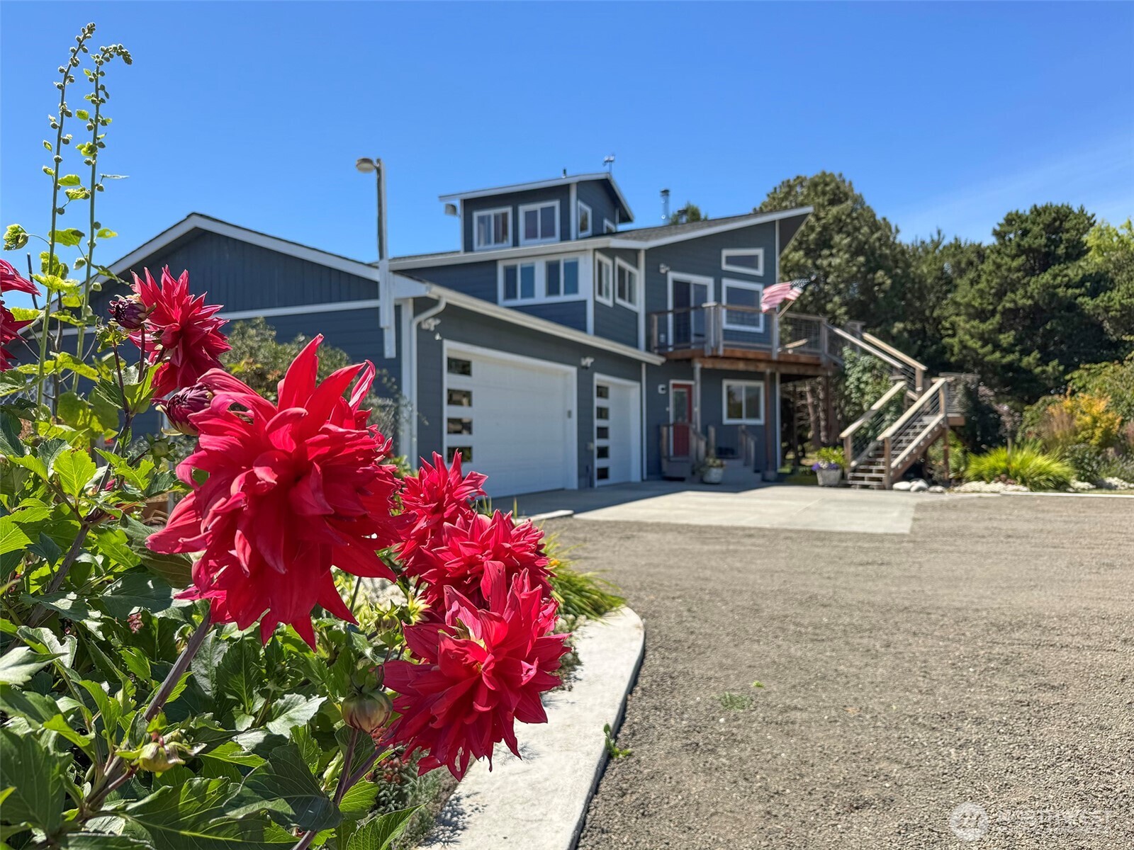 866 Jamestown Road Sequim, WA 98382 - Photo 40 of 40 a front view of a house with a yard and garage