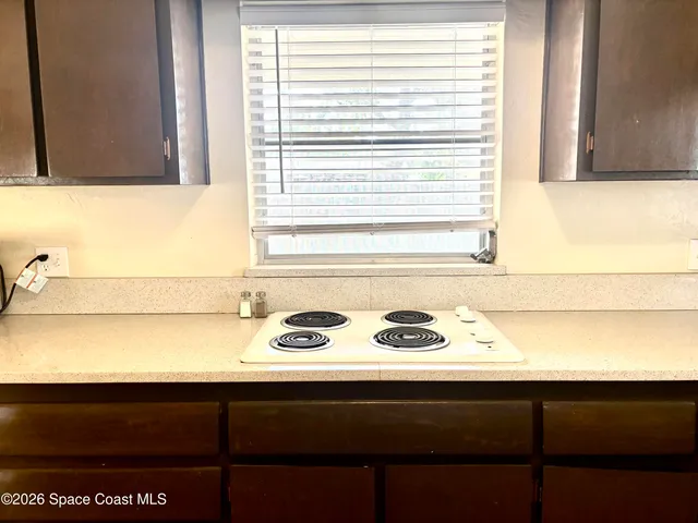 a and a washer and dryer sitting next to a window