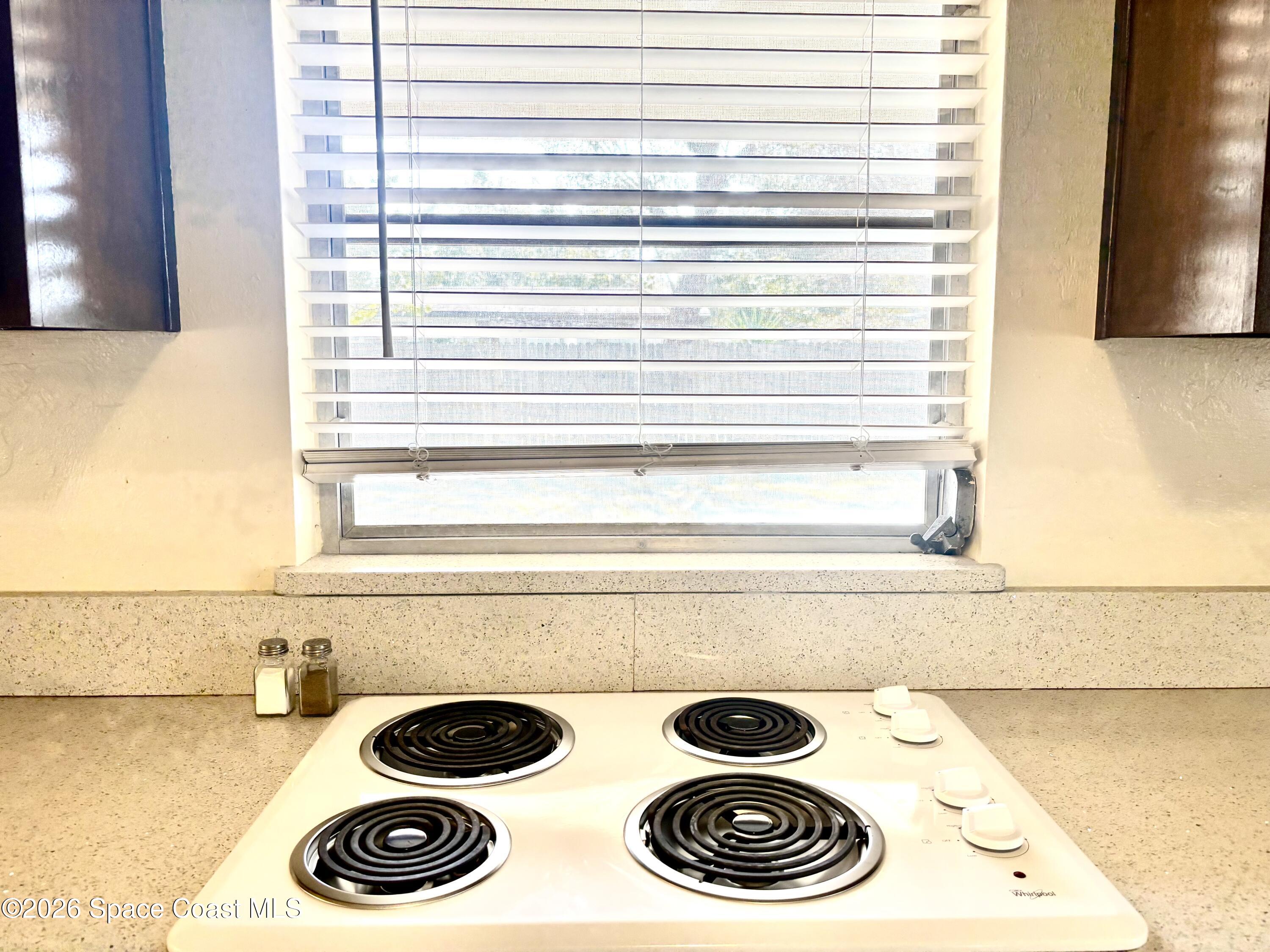 19 Orange Avenue Rockledge, FL 32955 - Photo 13 of 25 a and a washer and dryer sitting next to a window