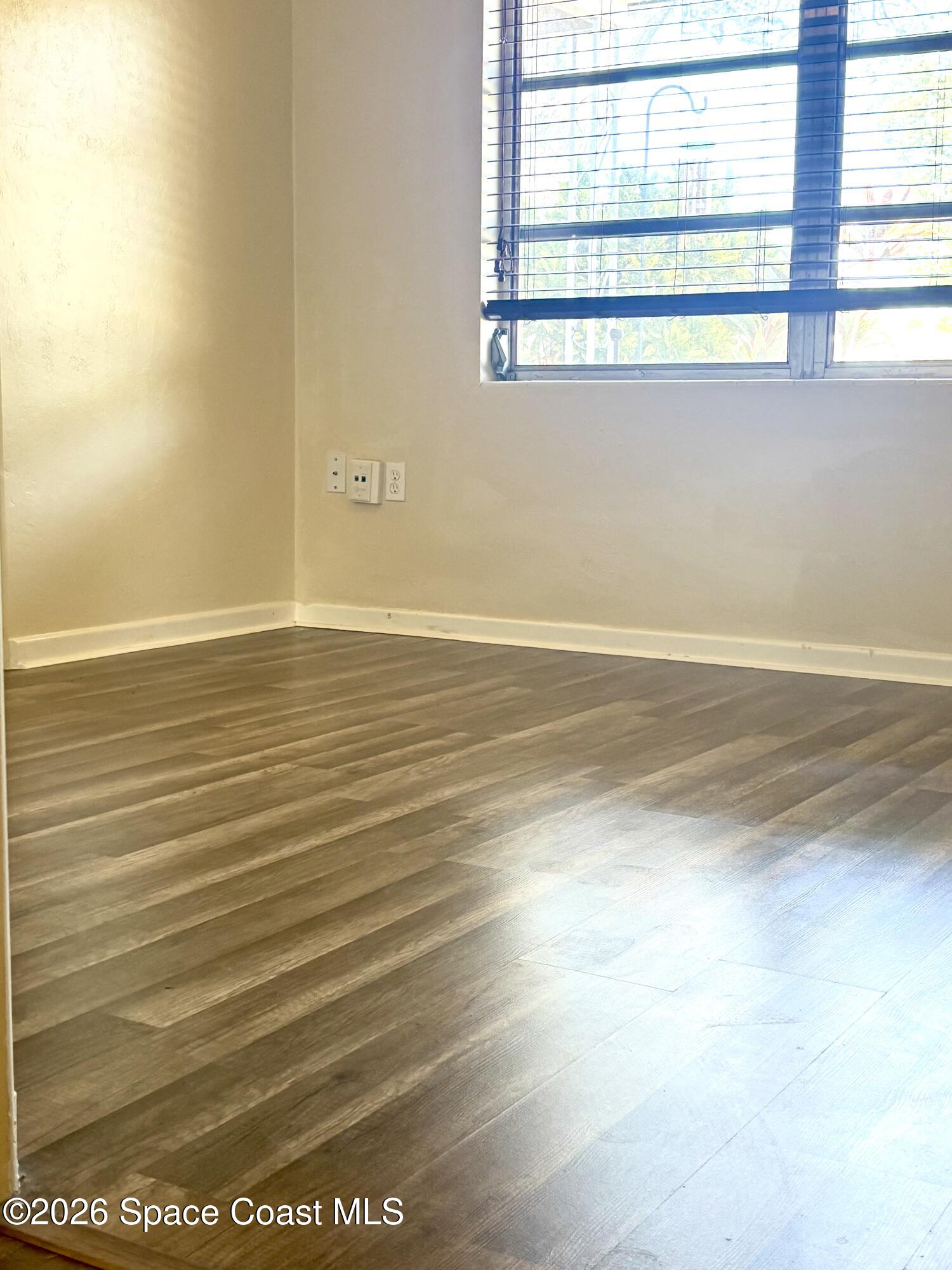 19 Orange Avenue Rockledge, FL 32955 - Photo 20 of 25 a view of a room with wooden floor