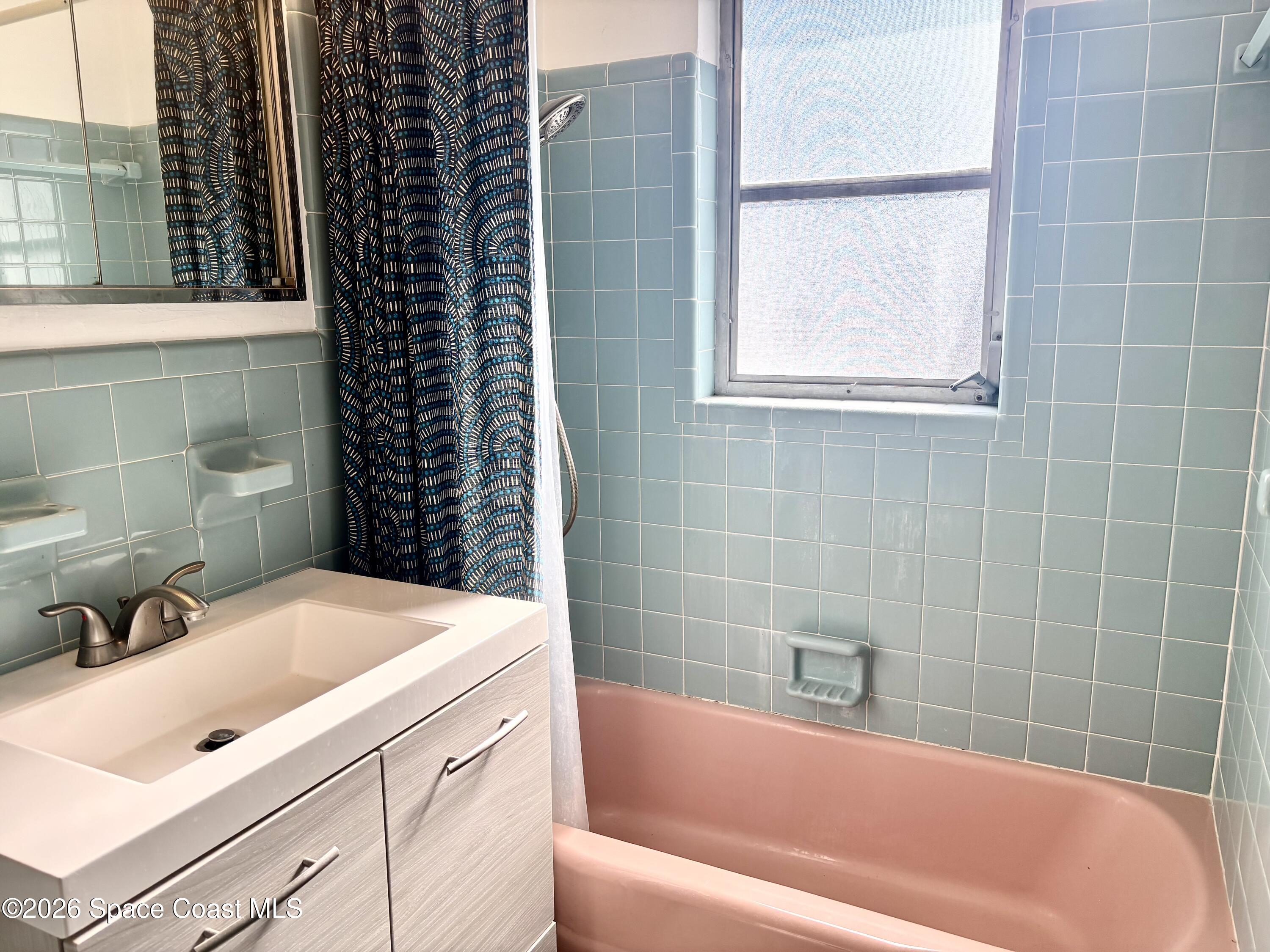 19 Orange Avenue Rockledge, FL 32955 - Photo 22 of 25 a bathroom with a bathtub and a sink