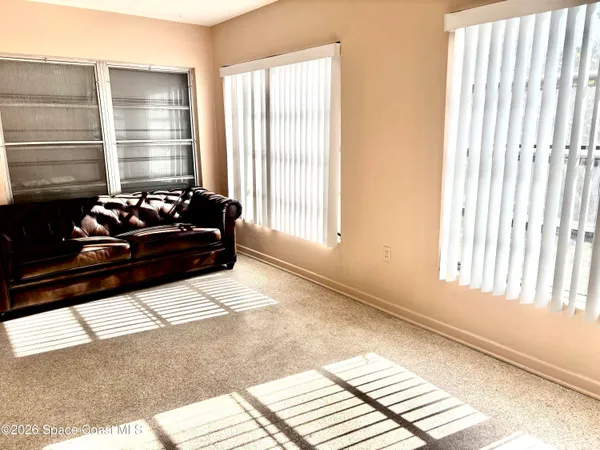 a view of empty room with windows