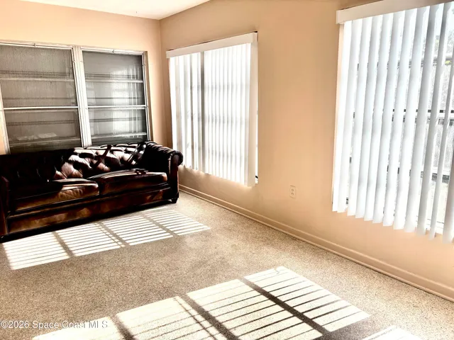 a view of empty room with windows