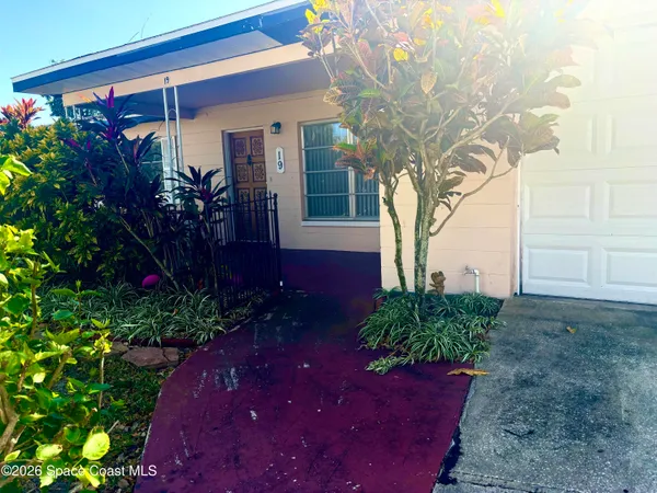 a view of a backyard of the house