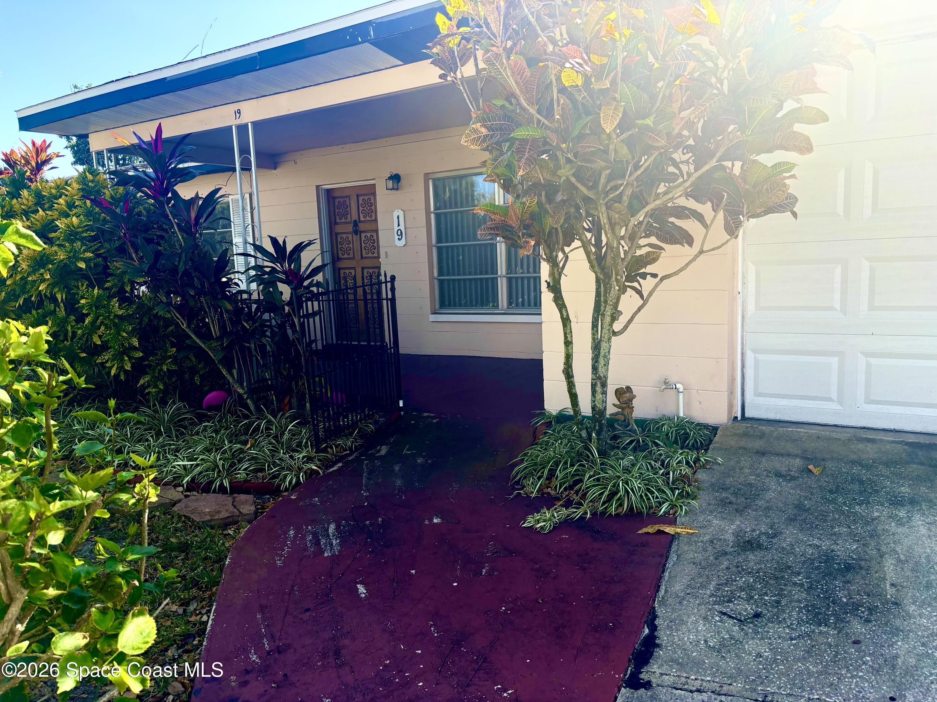 19 Orange Avenue Rockledge, FL 32955 - Photo 3 of 25 a view of a backyard of the house