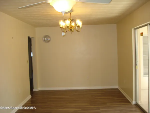 a view of a livingroom with wooden floor