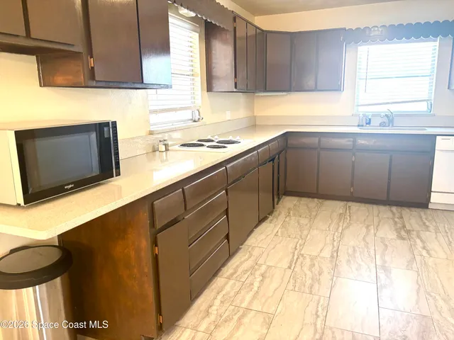 a kitchen with a sink and cabinets