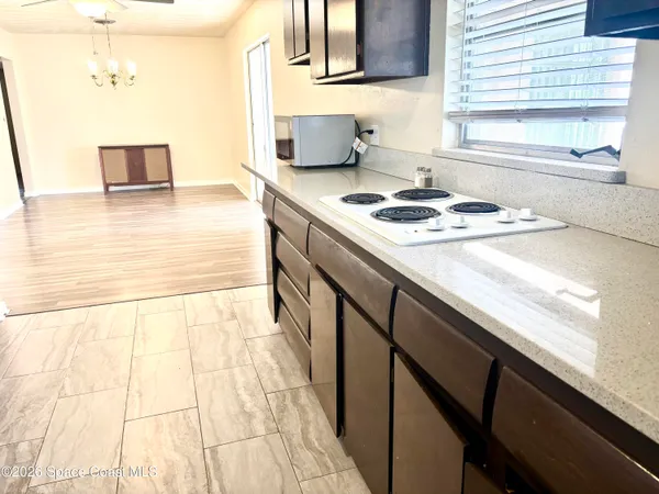 a kitchen with a sink and a stove