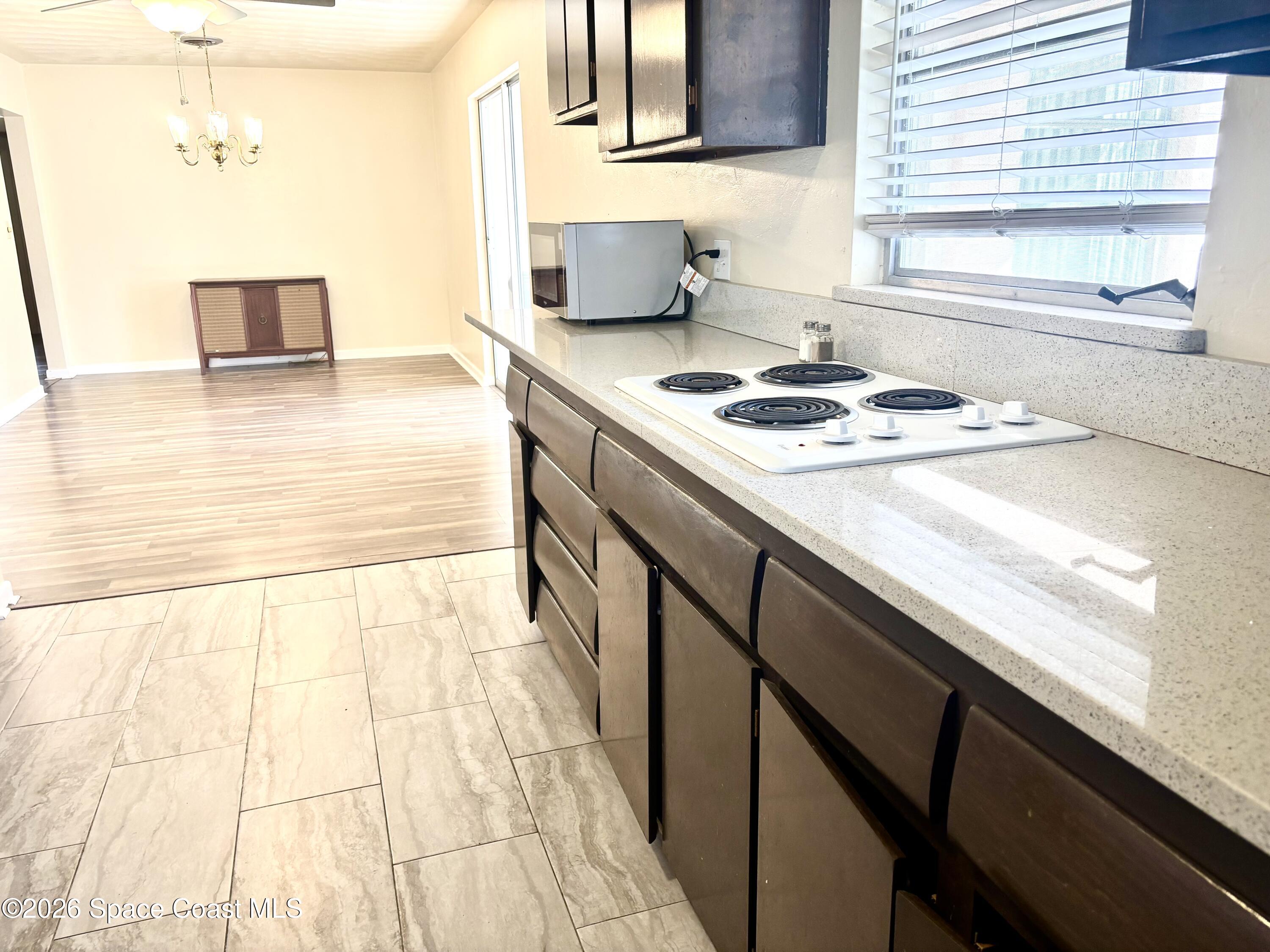 19 Orange Avenue Rockledge, FL 32955 - Photo 10 of 25 a kitchen with a sink and a stove