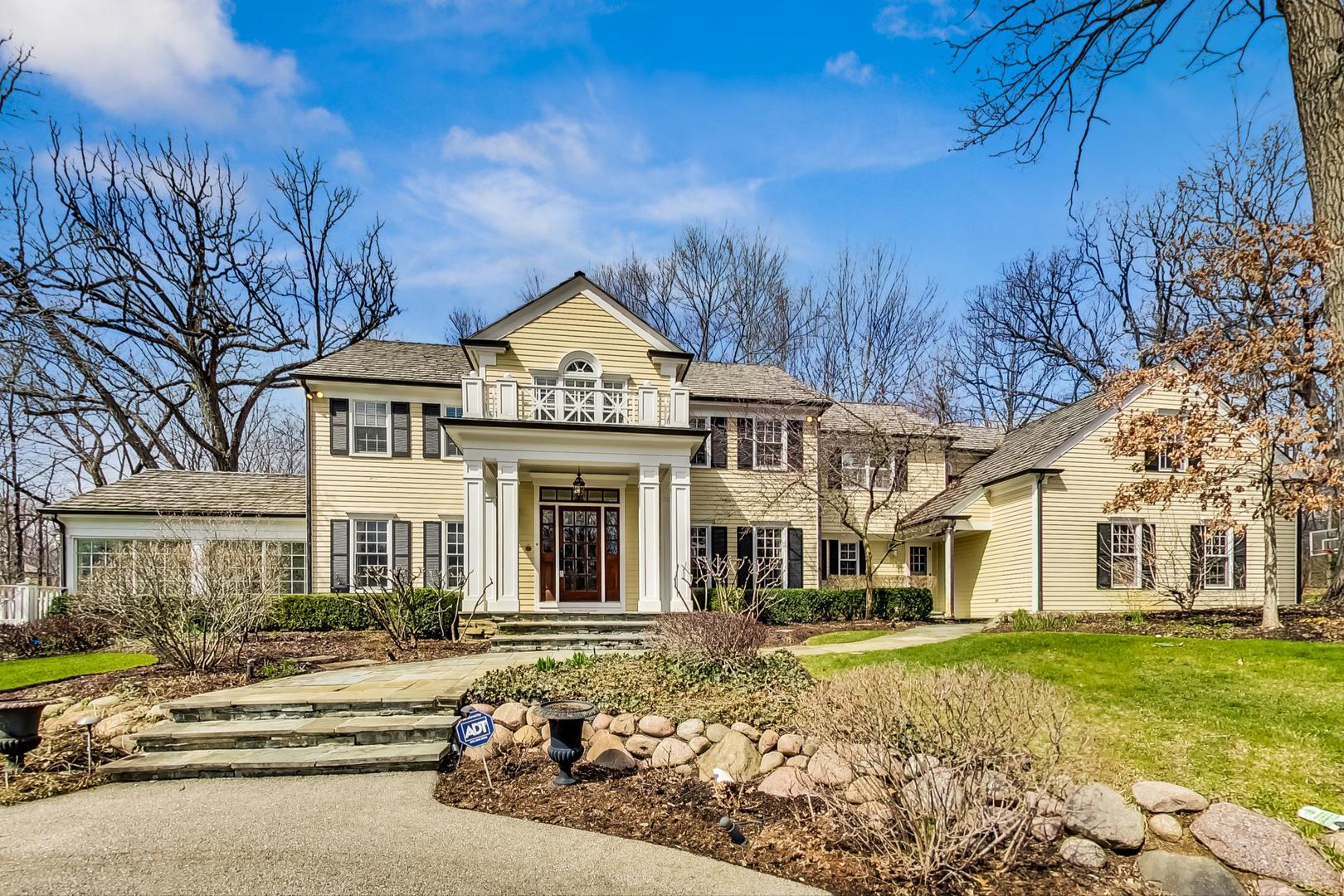 150 Firth Road Inverness, IL 60067 - Photo 1 of 83 a front view of a house with a garden