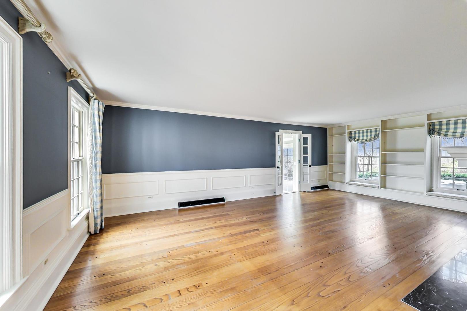 150 Firth Road Inverness, IL 60067 - Photo 12 of 83 a view of empty room with wooden floor and fan