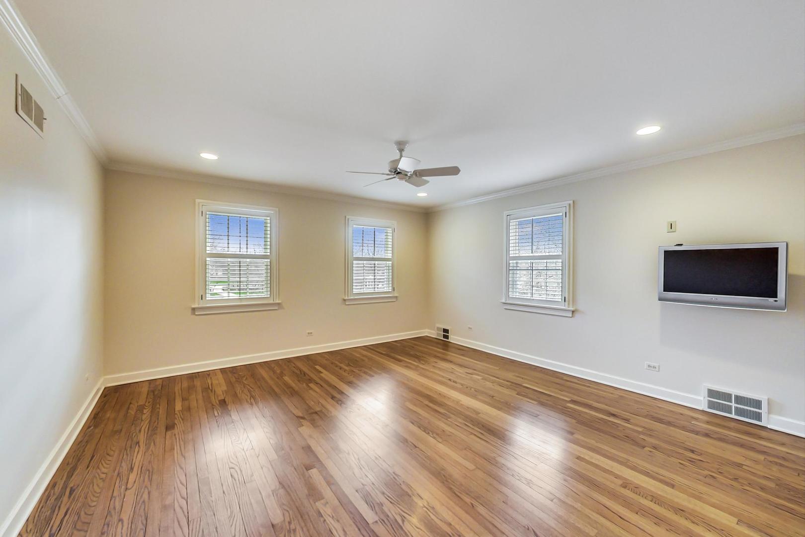 150 Firth Road Inverness, IL 60067 - Photo 36 of 83 a view of an empty room with wooden floor and a window