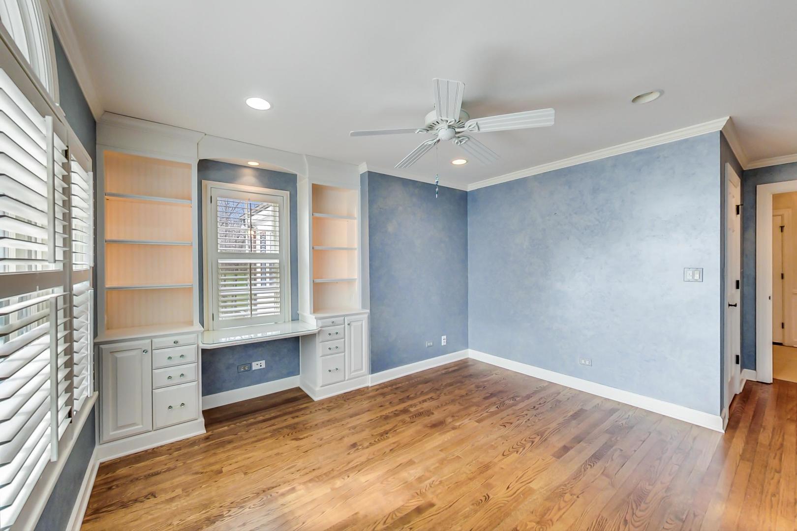 150 Firth Road Inverness, IL 60067 - Photo 55 of 83 an empty room with wooden floor and windows