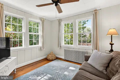 a bed room with a bed and a chair
