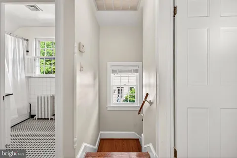 a room that has a window and a rug