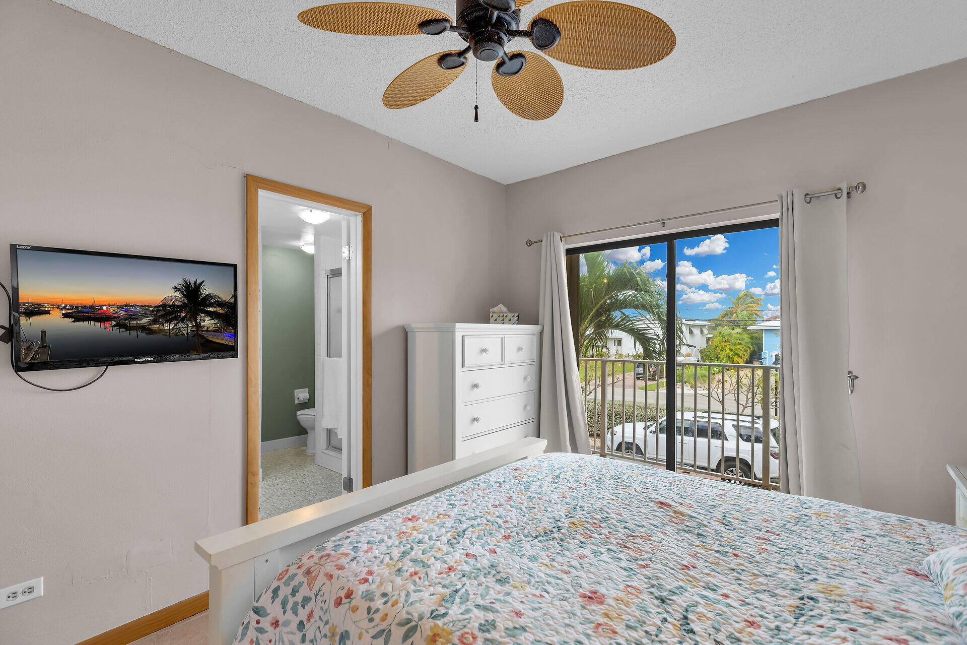 423 Sombrero Beach Road, Unit 9 Marathon, FL 33050 - Photo 16 of 42 a bedroom with a bed and a large window