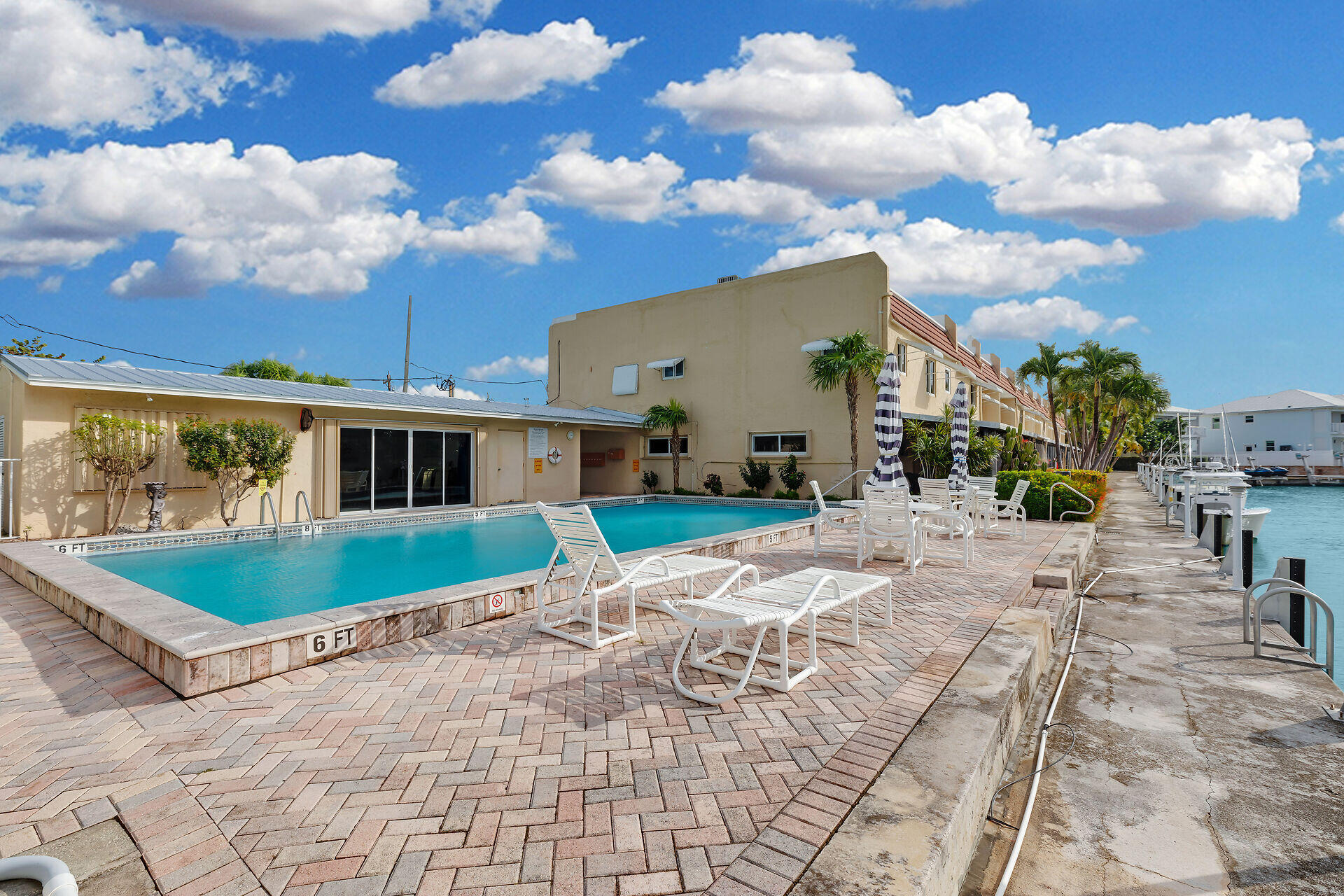 423 Sombrero Beach Road, Unit 9 Marathon, FL 33050 - Photo 38 of 42 a view of a house with backyard and sitting area