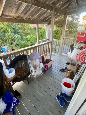 a view of backyard with a car parked