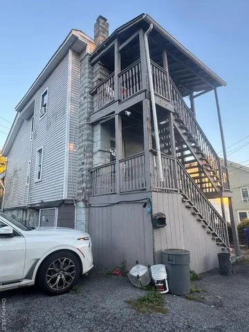 a front view of a house with parking space