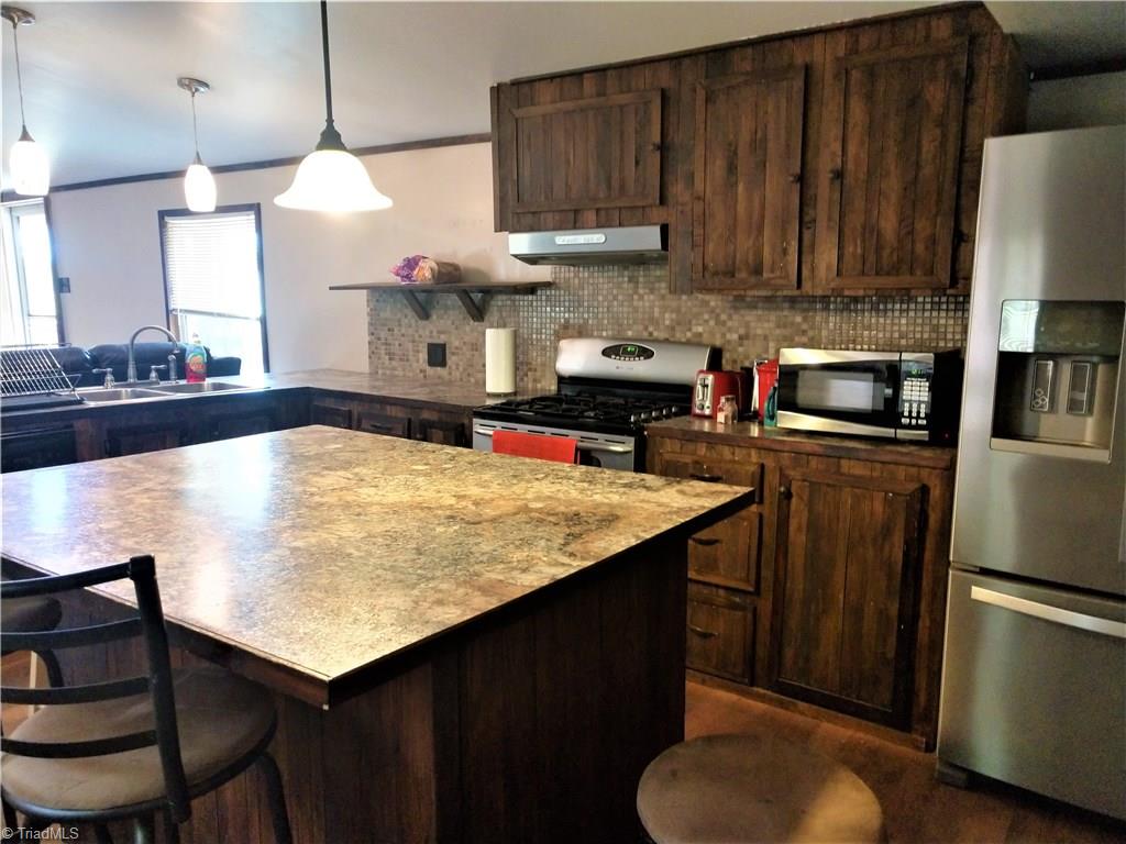 5712 Hayes Farm Road Seagrove, NC 27341 - Photo 6 of 16 Kitchen - Updated Lighting, Gas Stove