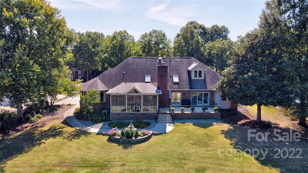 475 Beacon Knoll Lane Fort Mill, SC 29708 - Photo 36 of 43 a view of a house with swimming pool and a yard