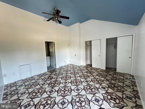 9110 Canterbury Riding, Unit 129 Laurel, MD 20723 - Photo 18 of 20 a bedroom with a bed and a chandelier