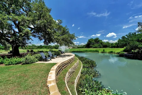 a view of a golf course with a lake view
