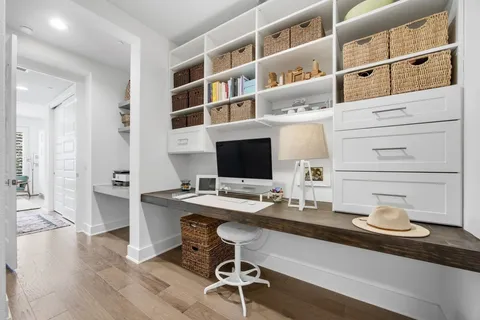 a room with a workspace and a couch