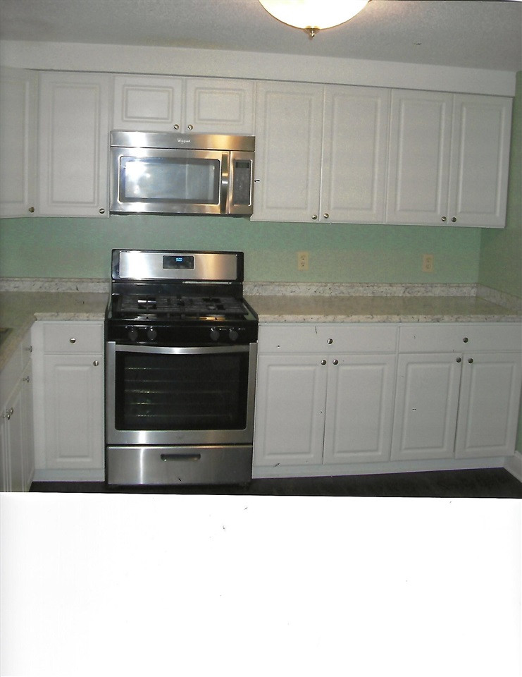 7332 Shellburne Drive Raleigh, NC 27612 - Photo 3 of 5 part of kitchen